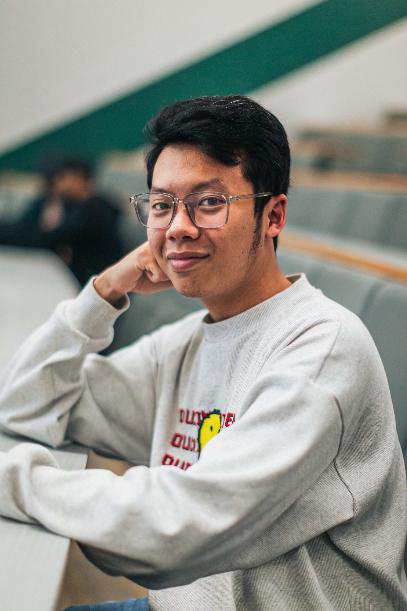 Participant resting chin on hand, thinking through a problem