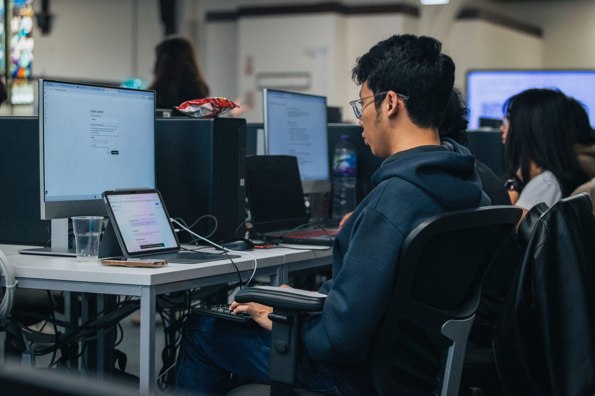The hackathon floor at Northumbria University, teams at workstations