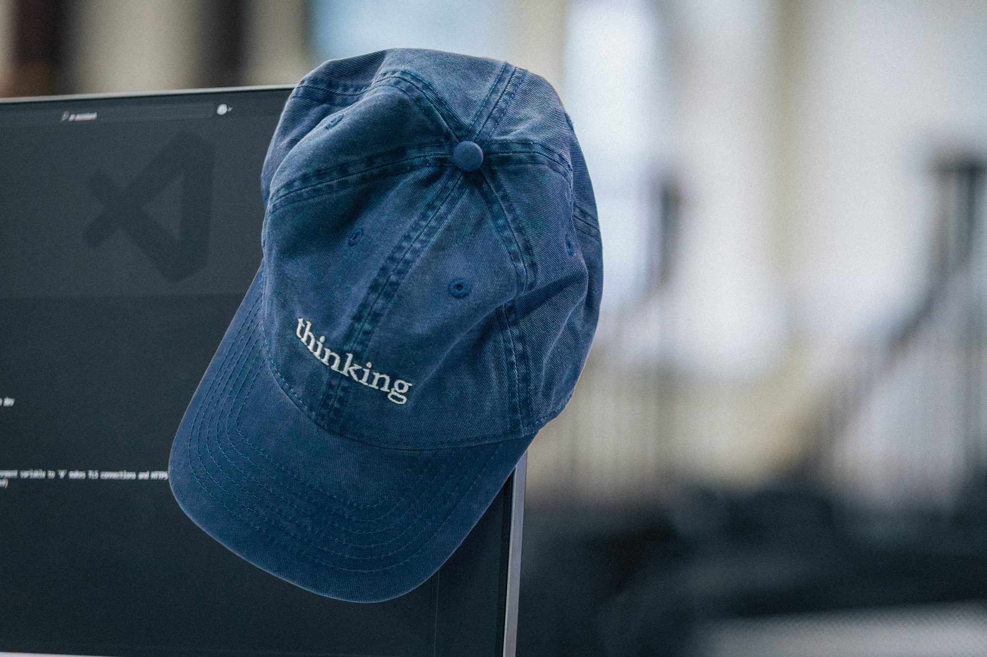 Branded cap on a stand, an event detail
