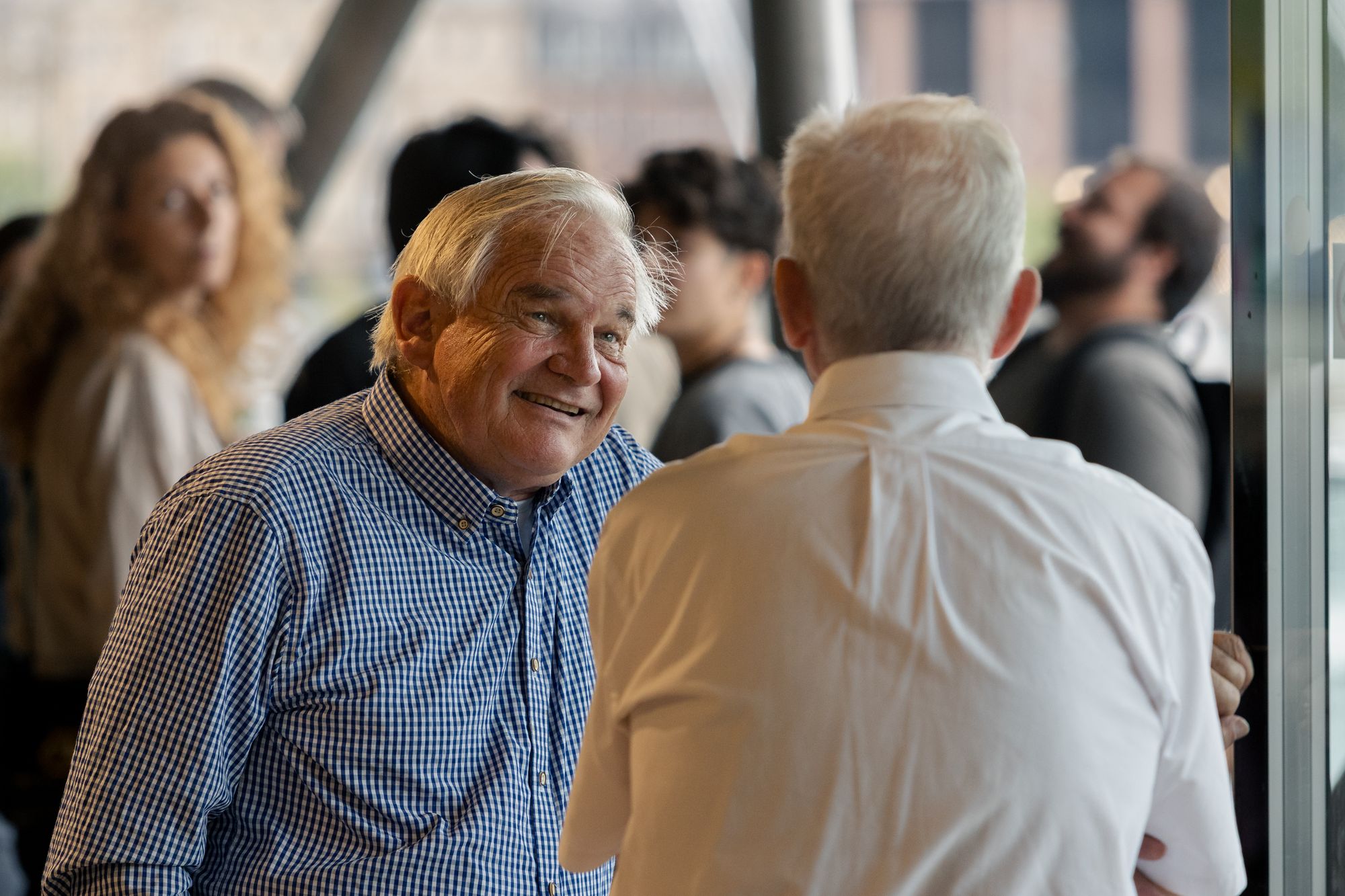 Two delegates in conversation at the icebreaker reception