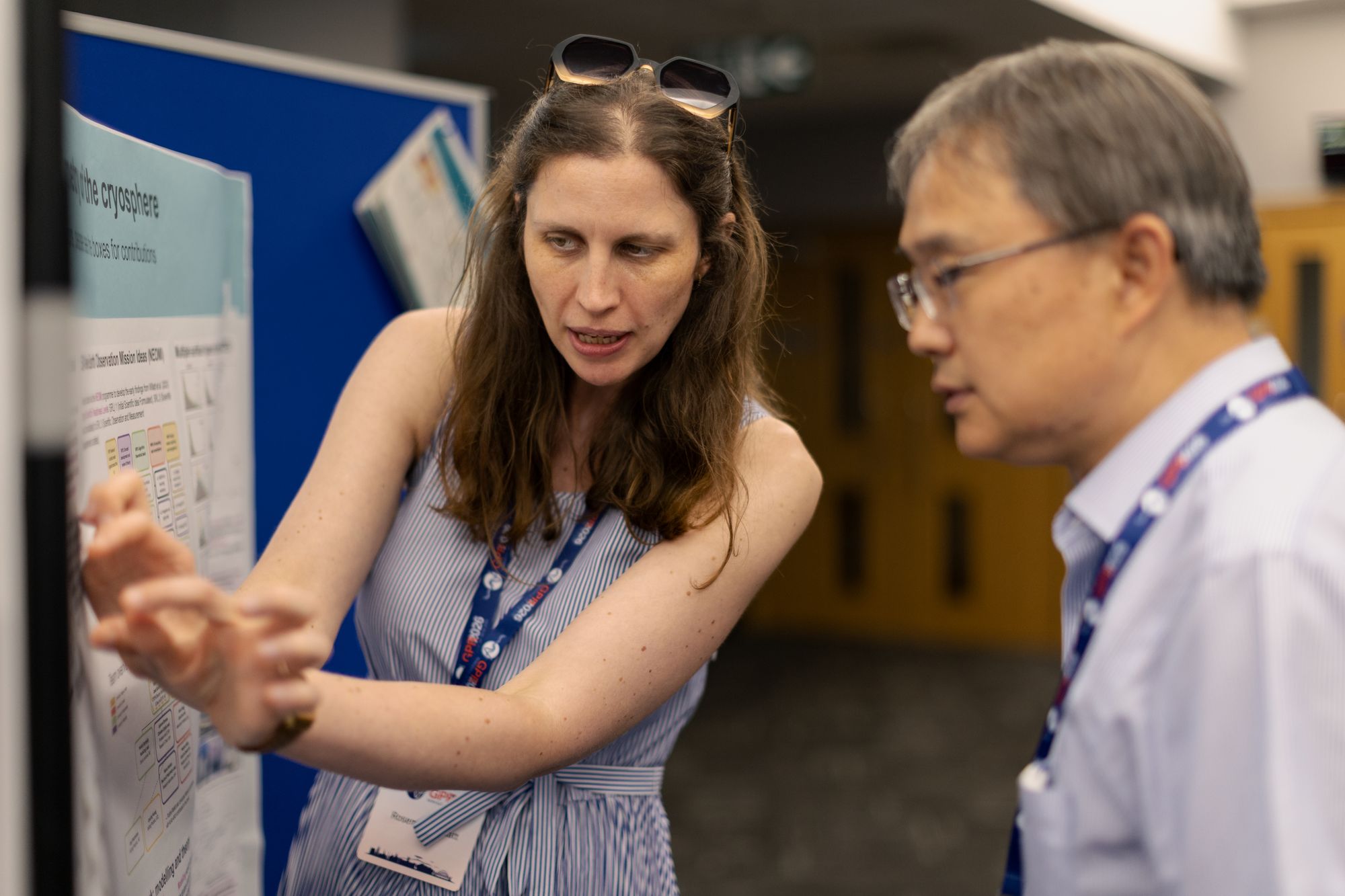 Researchers discussing work at the poster exhibition