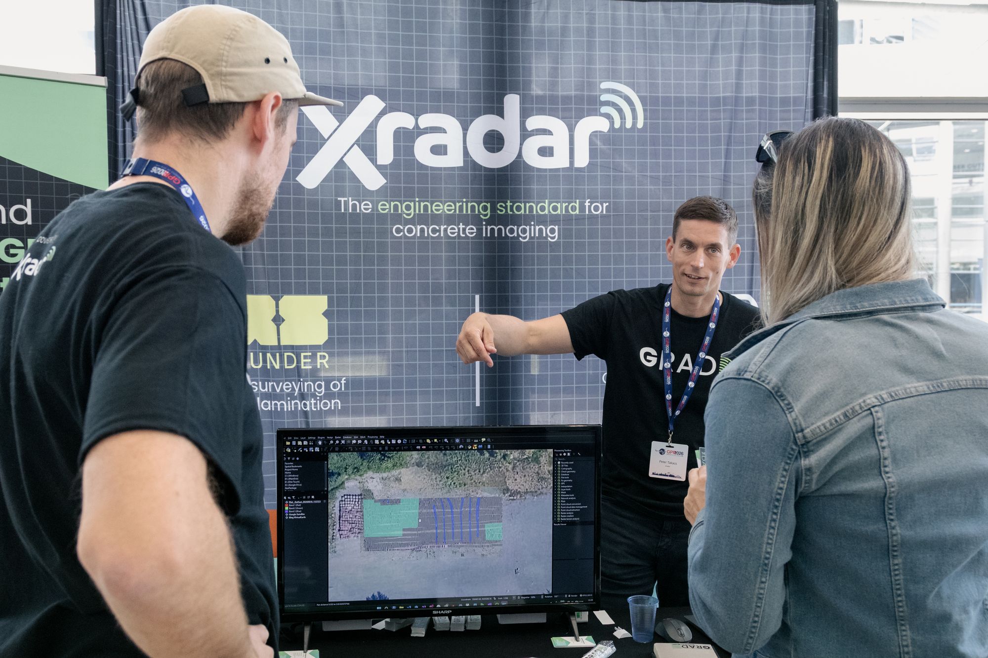 An exhibitor demonstrating ground-penetrating-radar imaging at the Xradar stand
