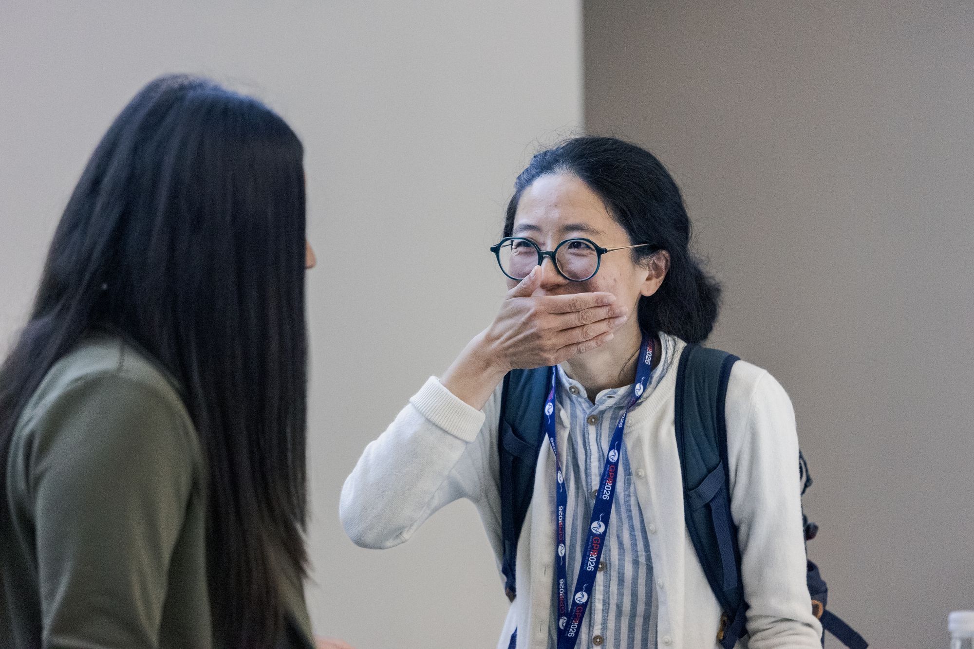 A delegate laughing during a break between sessions